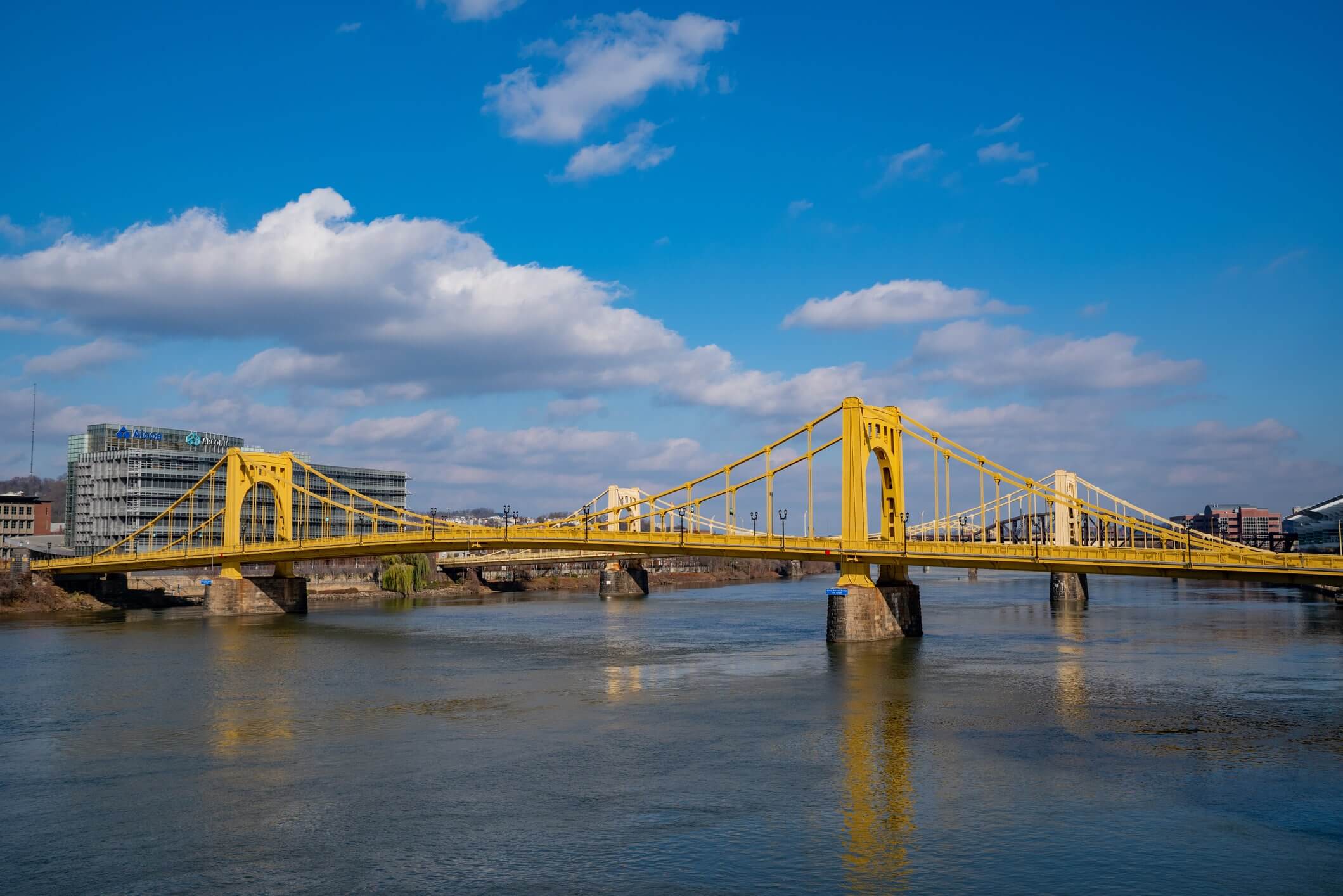 Iconic yellow Pittsburgh bridge spans wide river