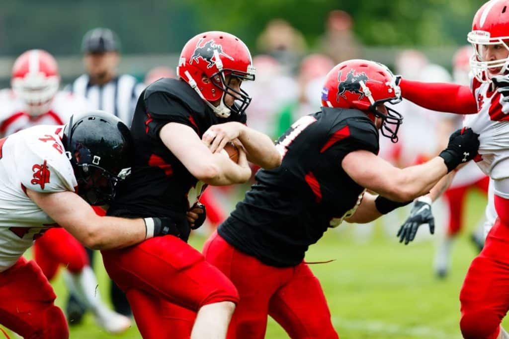 Football players tackling fiercely during intense game