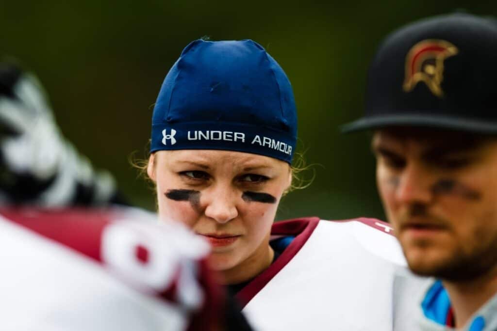 Female athlete with eye black and Under Armour