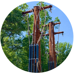 PoleRiser ProjectOverview installed on brown utility poles