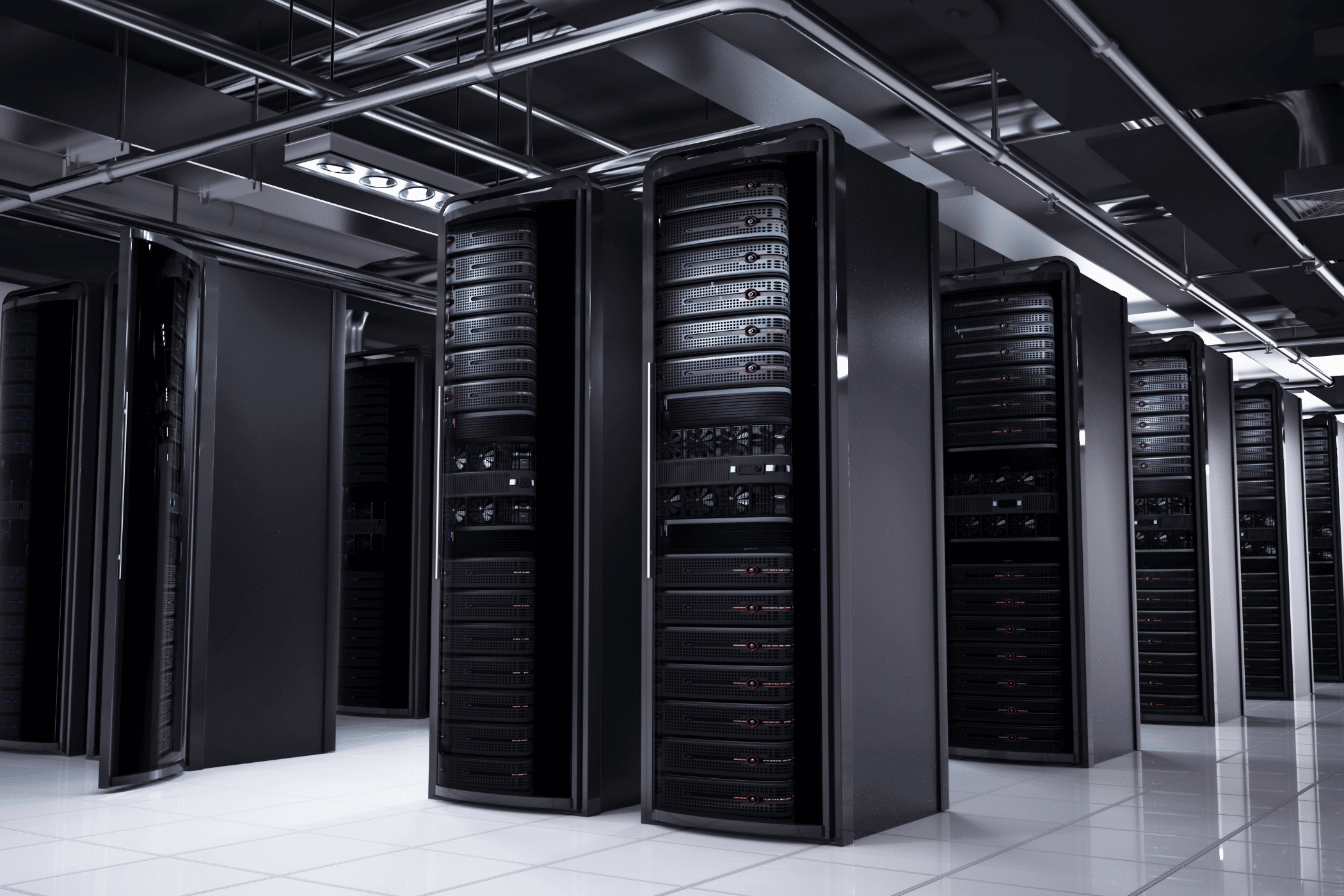 Black server racks line data center aisle center.